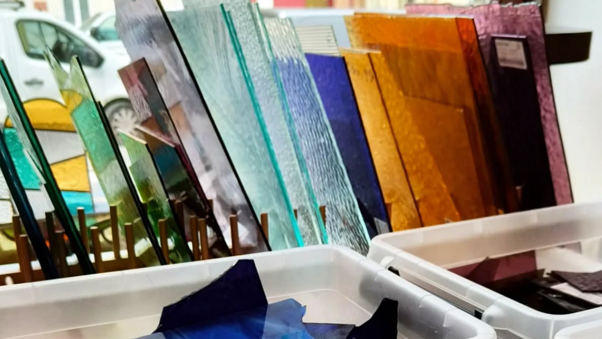 rack with lots of sheets of glass in different colors