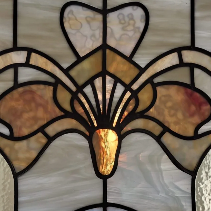 Detail of a art nouveau stained glas window inspired by victor Horta's telephen cabin.