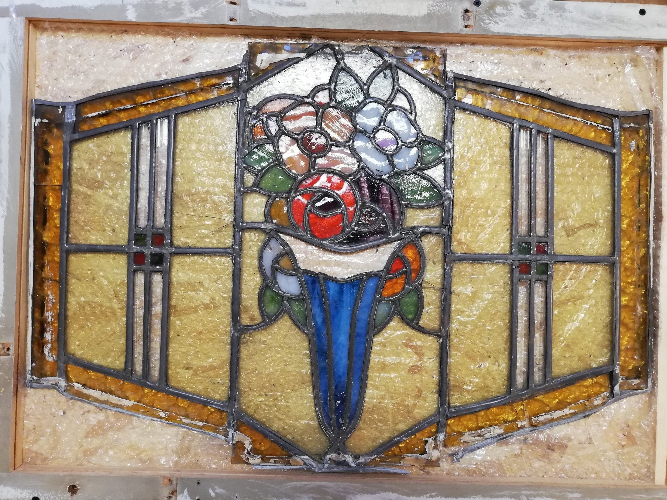 Stained glass art deco floral motive before resoration.